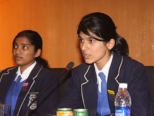 Student representative poses a question during the open house