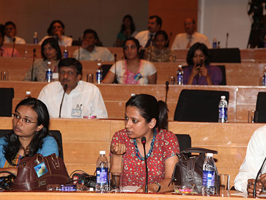 Media representative poses a question during the open house