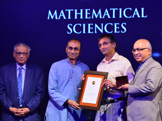Prize Presentation by Dr. Venkatraman Ramakrishnan to winner Prof. Akshay Venkatesh with Prof. Srinivasa Varadhan and Mr. K. Dinesh