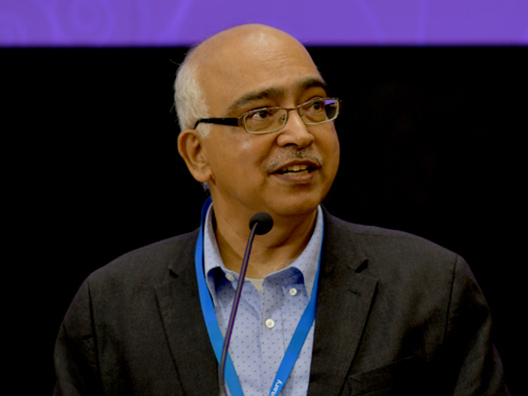 Mr K. Dinesh announcing the winner for Mathematical Sciences