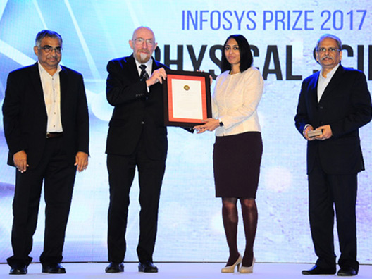 Prof Yamuna Krishnan receiving the Infosys Prize 2017 from Nobel Laureate Prof Kip Thorne, with Mr Gopalakrishnan and Prof Kulkarni