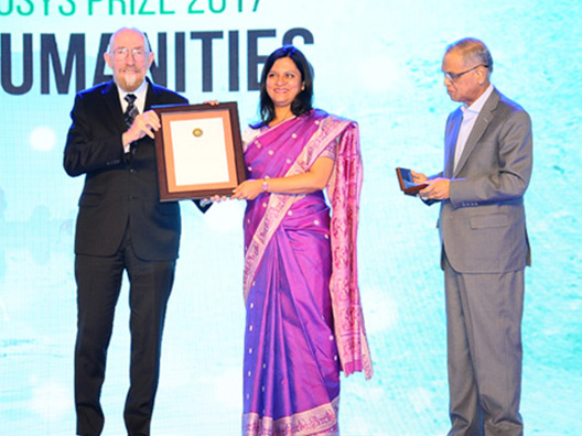 Prof Ananya Kabir receiving the Infosys Prize from Nobel Laureate Prof Kip Thorne, also in picture Prof Akeel Bilgrami and Mr Narayan Murthy