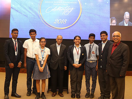Student announcers with Mr. Narayana Murthy, Trustee, ISF and Mr. K. Dinesh, President, ISF Board of Trustees