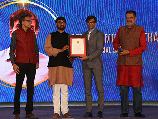 Prof. Sendhil Mullainathan receives the Infosys Prize in Social Sciences from Prof. Manjul Bhargava