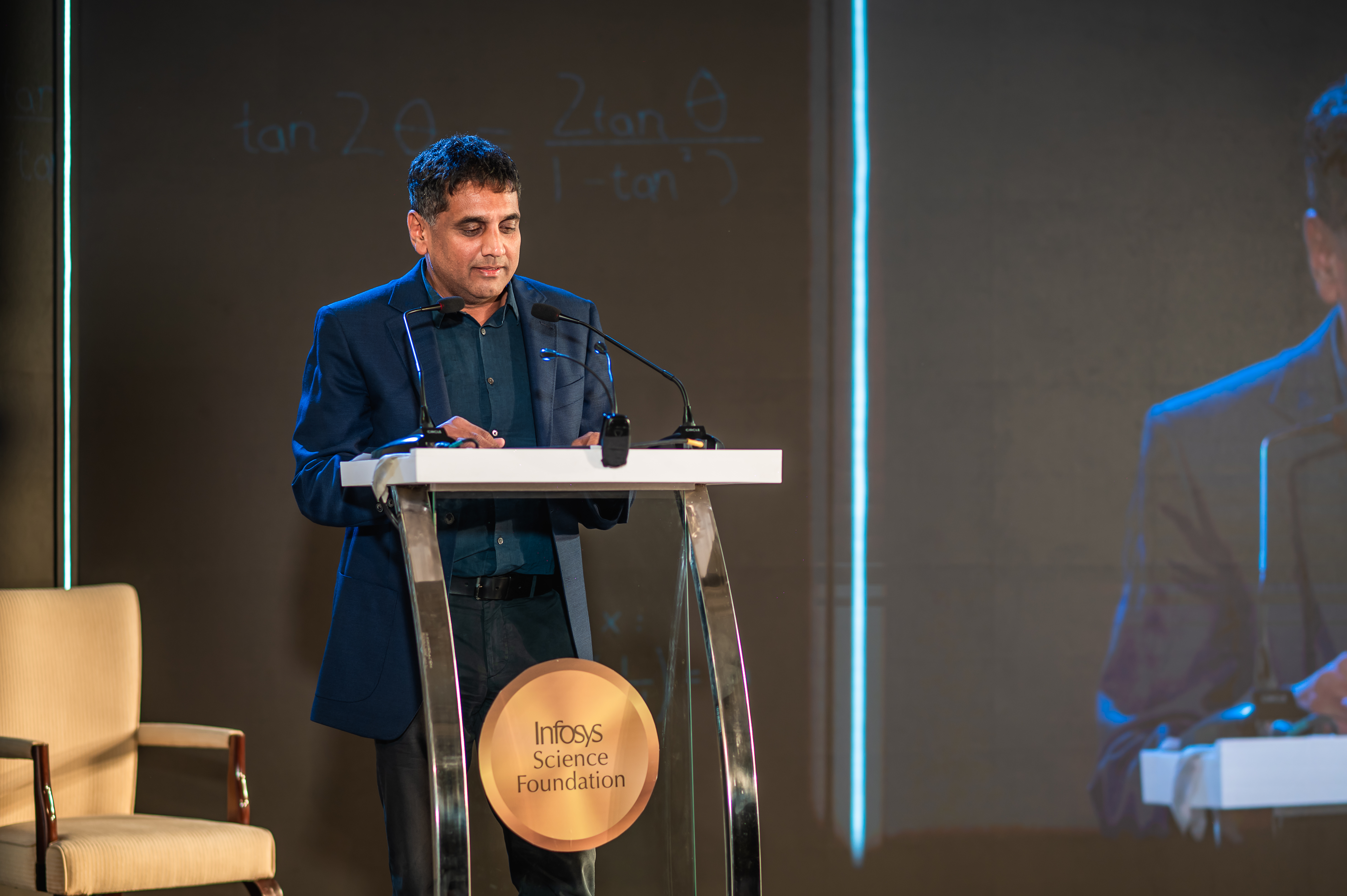 Prof. Chandrashehar reading the jury's citation of Prof. Mahesh Kakde's work at the Infosys Prize Ceremony 2022