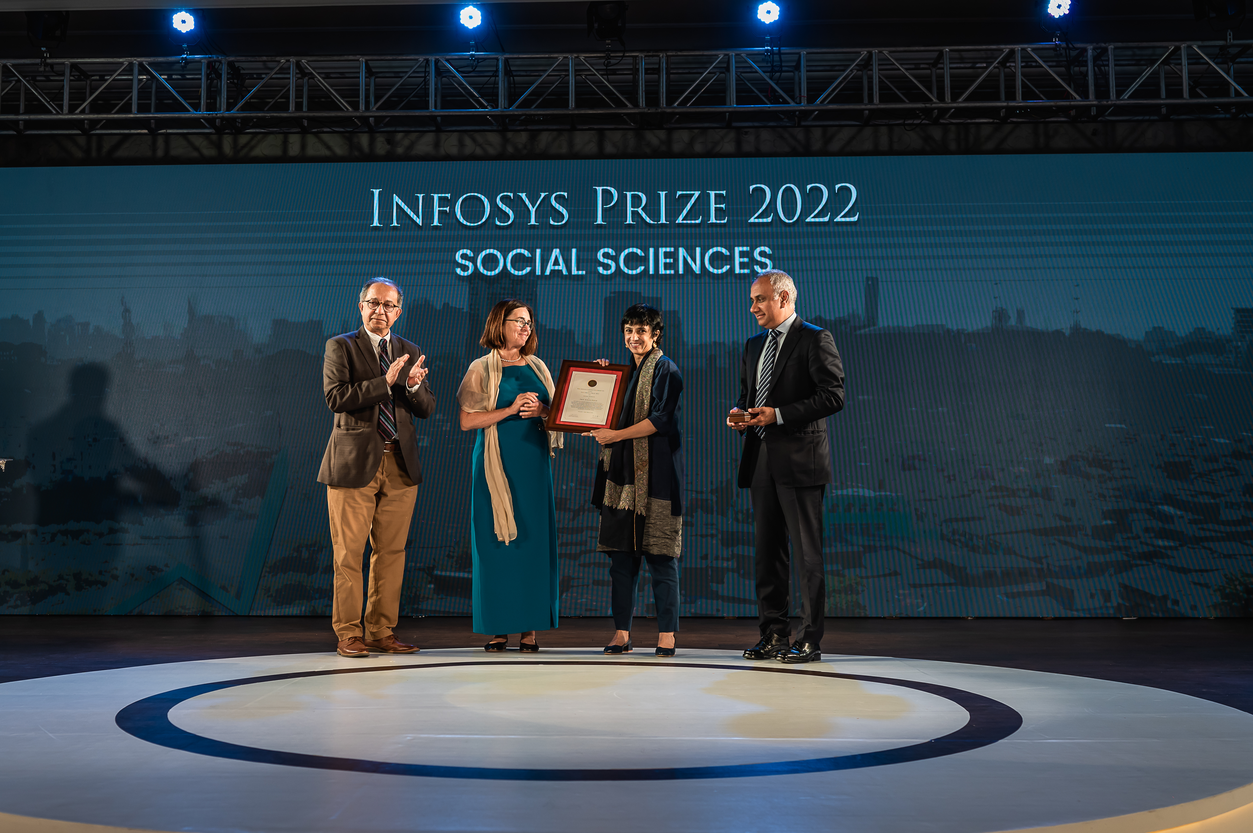 Prof. Kaushik Basu, Prof. Shafi Goldwasser and Mr. Salil Parekh presenting the Infosys Prize 2022 to Prof. Rohini Pande