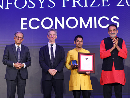 Prof. Kaushik Basu, Prof. Peter Sarnak, and Mr. Mohandas Pai presenting the Infosys Prize 2024 to Prof. Arun Chandrasekhar