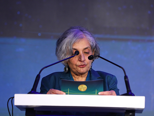 Prof. Jayathi Murthy reading the jury’s citation of Prof. Shyam Gollakota’s work at the Infosys Prize Ceremony 2024