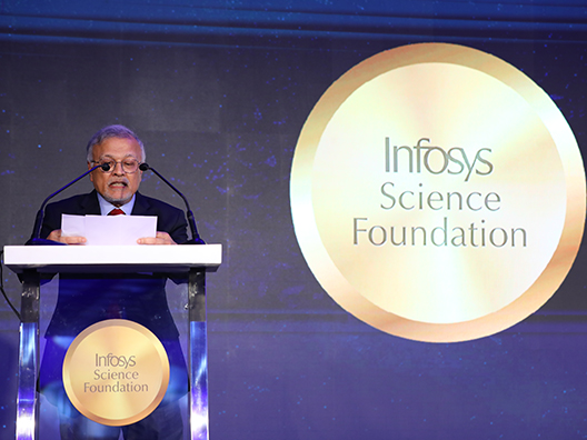 Prof. Mriganka Sur reading the jury’s citation of Prof. Siddhesh Kamat’s work at the Infosys Prize Ceremony 2024