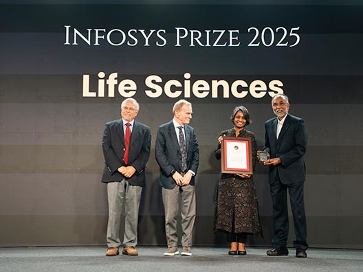 Prof. Mriganka Sur, Prof. Randy Schekman, and Mr. S.D. Shibulal presenting the Infosys Prize 2025 to Prof. Anjana Badrinarayanan