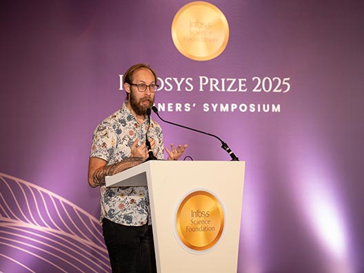 Prof. Andrew Ollett, 2025 humanities and social sciences winner presenting his work at the Infosys Prize Winners’ Symposium 2025